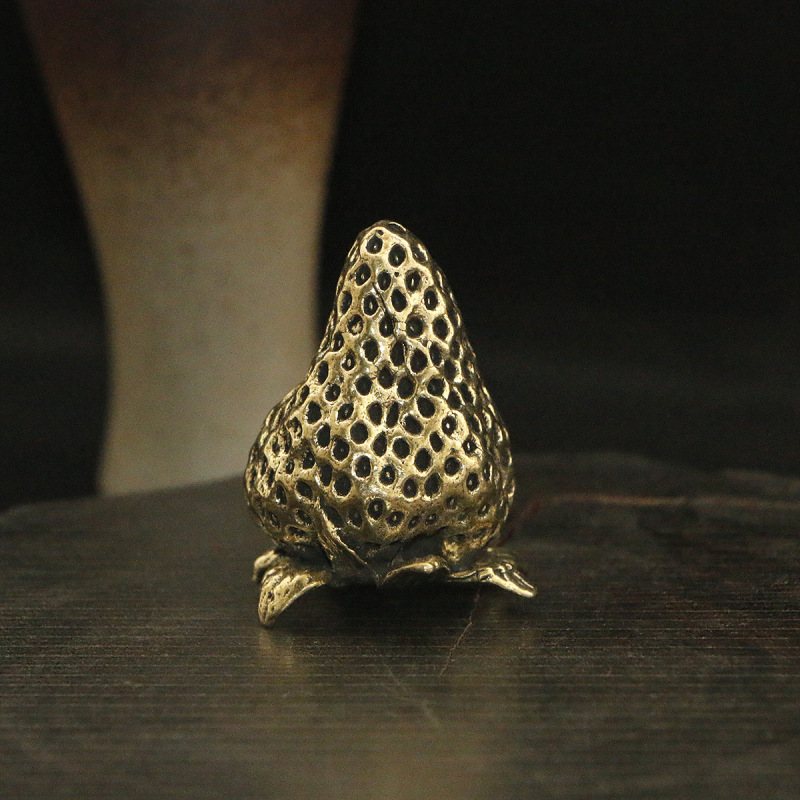 Simulated brass strawberry ornament