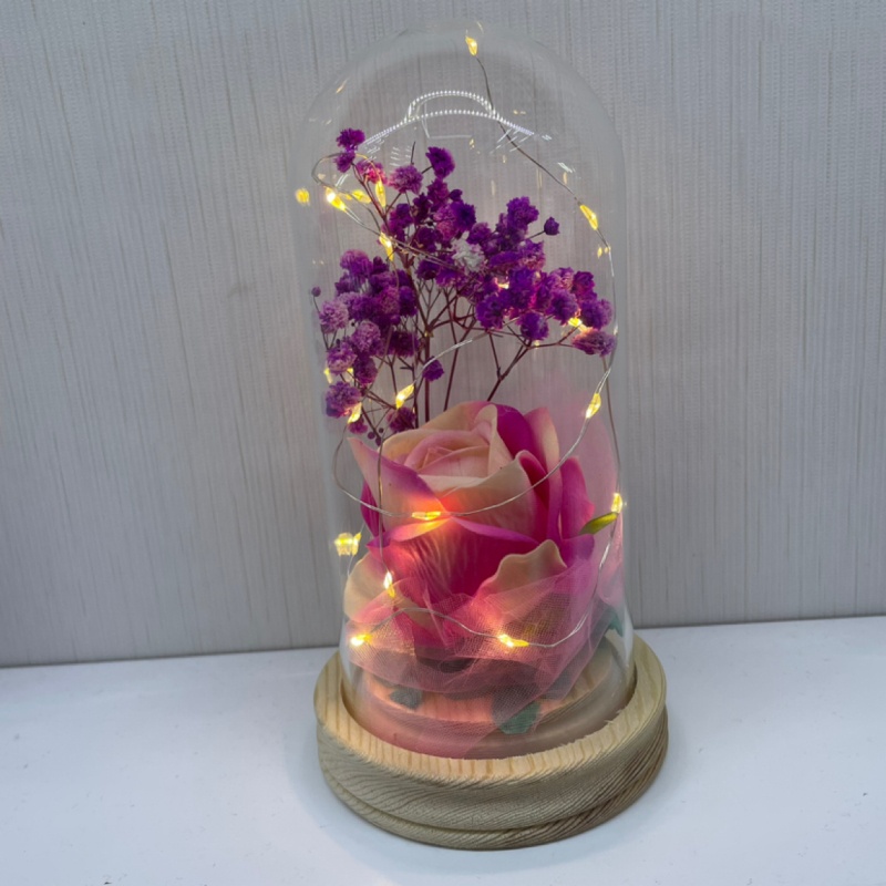 Simulated rose with glass cover