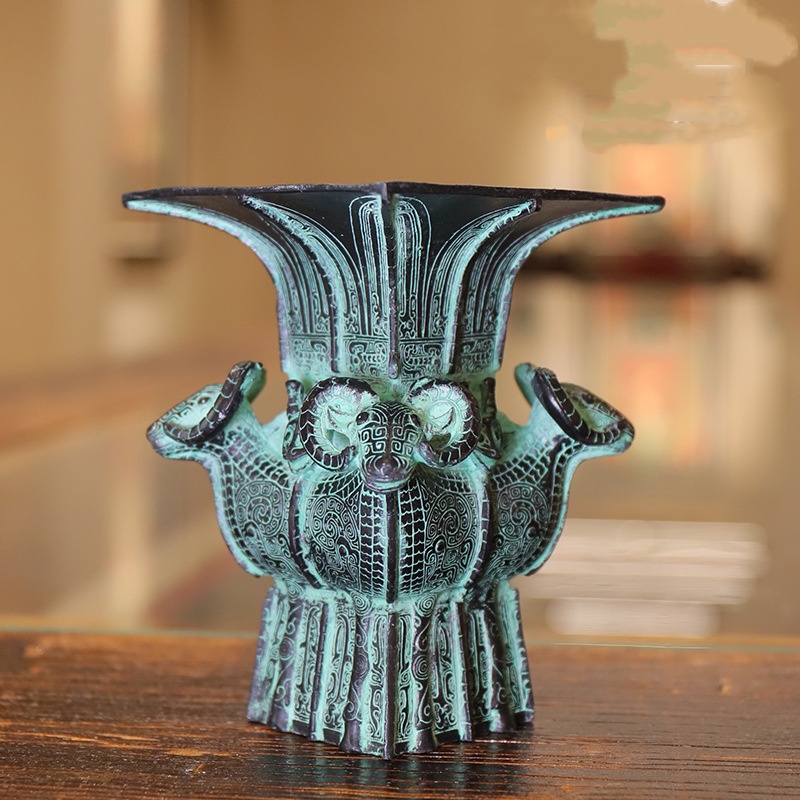 Antique bronze figurine in the shape of a square statue of four sheep