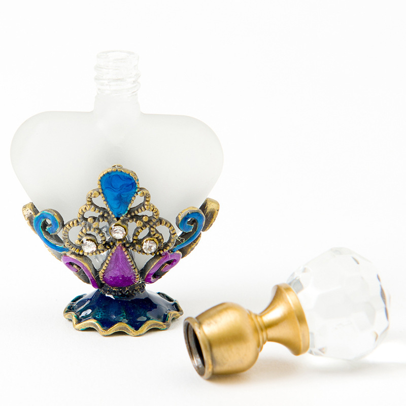 Vintage diamond studded heart-shaped essential oil bottle