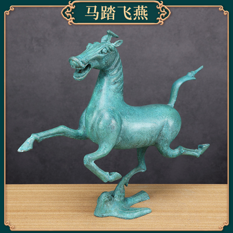 Antique bronze ornament with the shape of a horse stepping on a flying swallow
