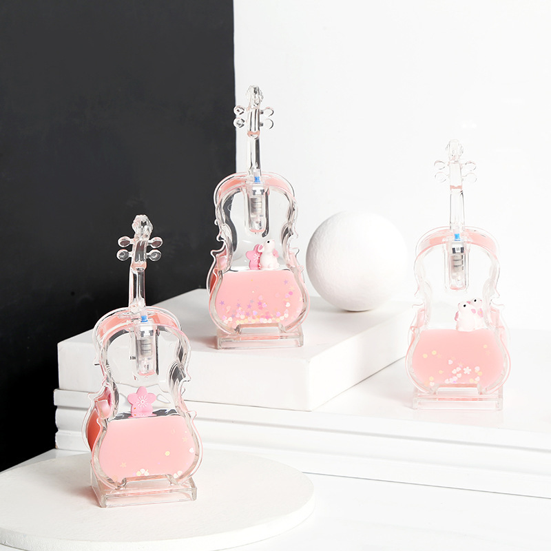 Pink glowing violin shaped crystal ornament