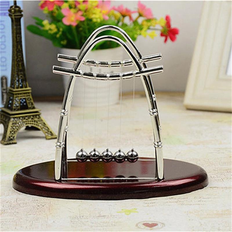 The Oval Newton’s Cradle: A Timeless Fusion of Science and Style